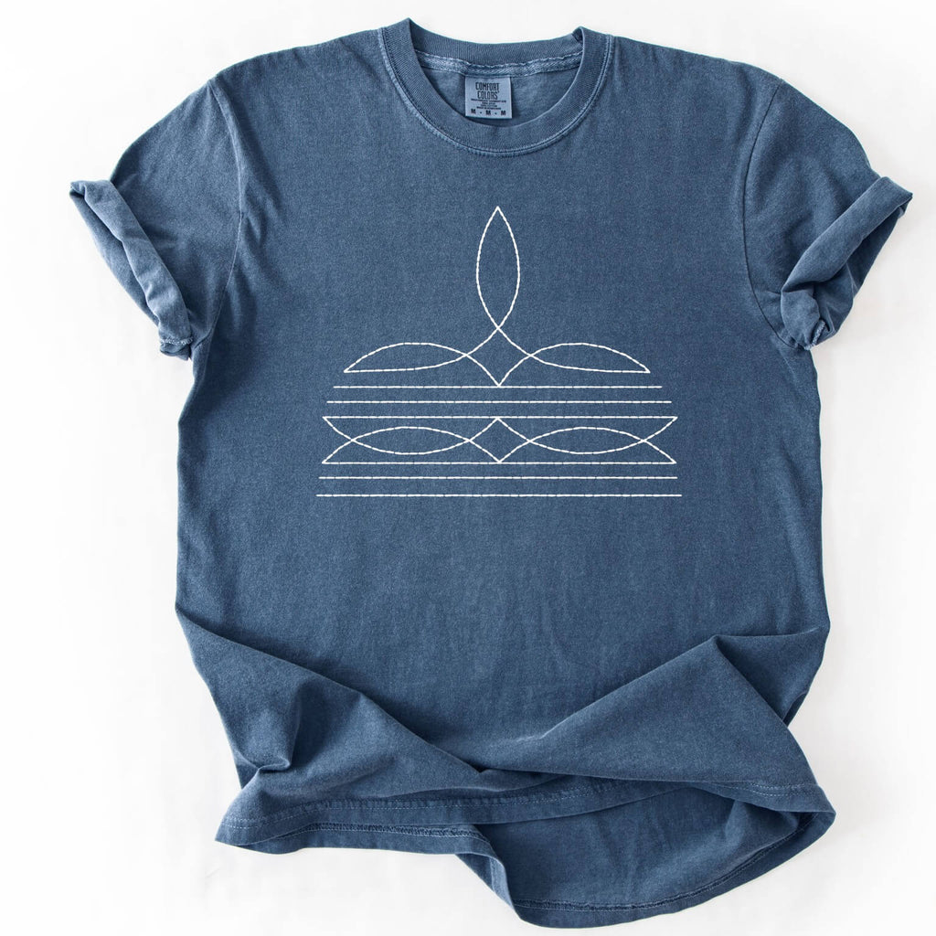 Blue t-shirt with white abstract design on a white background