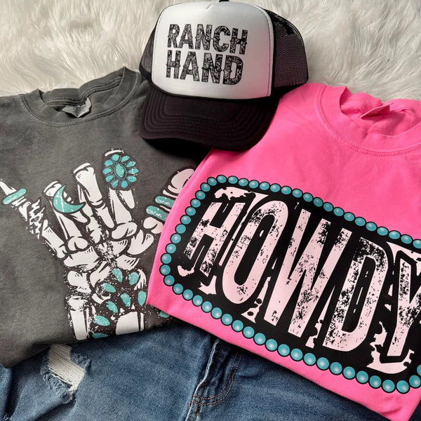 Colorful Western Style Fashion Sitting on a table hat & t-shirts