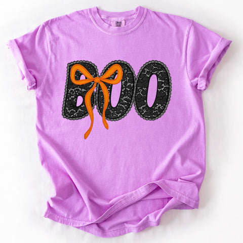 Purple Halloween t-shirt with 'BOO' and a bow design on a white background
