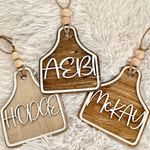 Custom Wooden Cow Ear Tag Ornament | Cattle - Themed Family Name Christmas Decor - The Stenciled Barn