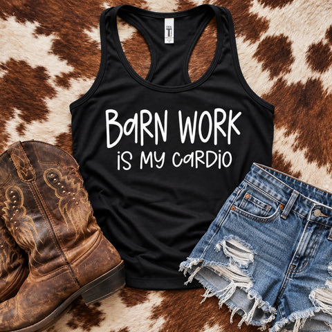 Black Barn Work Is My Cardio women's racerback tank top with white lettering, styled with denim shorts and cowboy boots on cowhide.