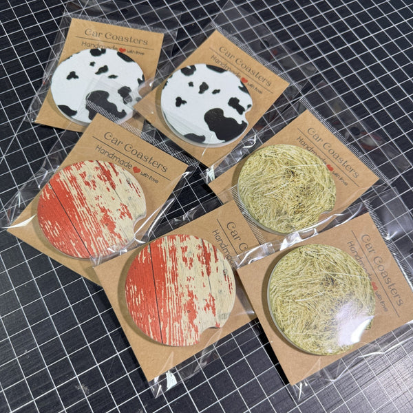 Country farmhouse car coaster collection displayed on a flat surface with handcrafted packaging.