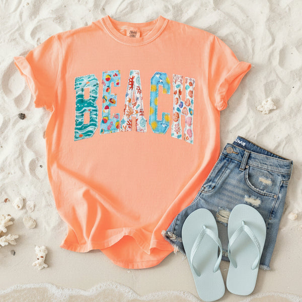 Neon cantaloupe Comfort Colors beach graphic tee with colorful coastal patchwork applique lettering