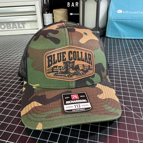 Blue Collar camo Richardson 112 trucker hat with brown leather patch and black mesh back