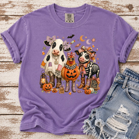 Purple Comfort Colors Halloween graphic tee featuring a cow, chicken and pig in festive costumes with pumpkins, candy corn and country details