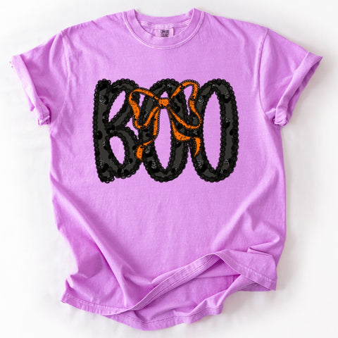 Boo Halloween graphic printed on a Neon Violet Comfort Colors unisex graphic tee with black leopard print lettering and orange bow