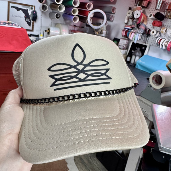 Tan trucker hat with black western boot stitch design and black chain trim on the brim. New condition foam front mesh back country western hat.
