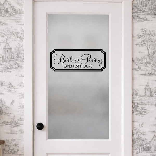 Frosted glass door with 'Butler's Pantry Open 24 Hours' decal against a patterned wallpaper background