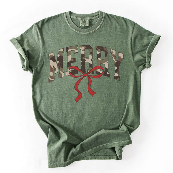 Vintage green Christmas tee with “Merry” in camo lettering and a red bow, photographed flat lay.