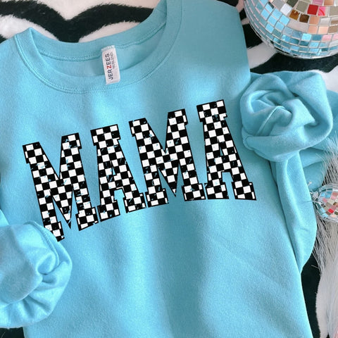 Aqua blue sweatshirt with bold distressed black and white checkered MAMA graphic displayed on a cozy styled flat lay.