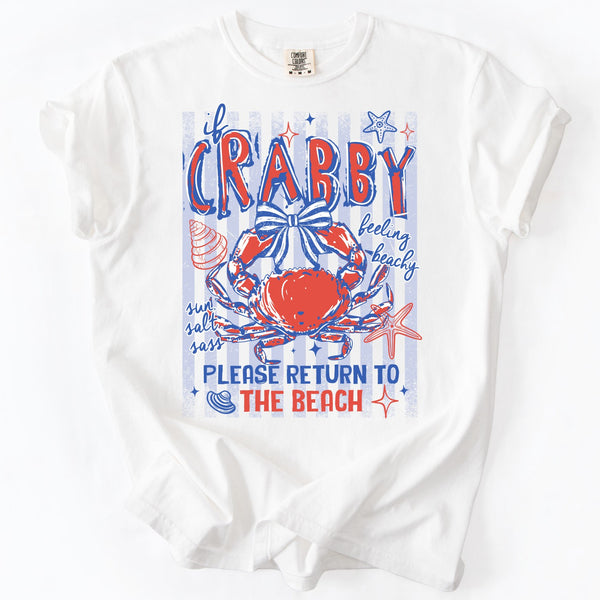 White t-shirt with a colorful graphic of a crab and beach-themed text on a white background