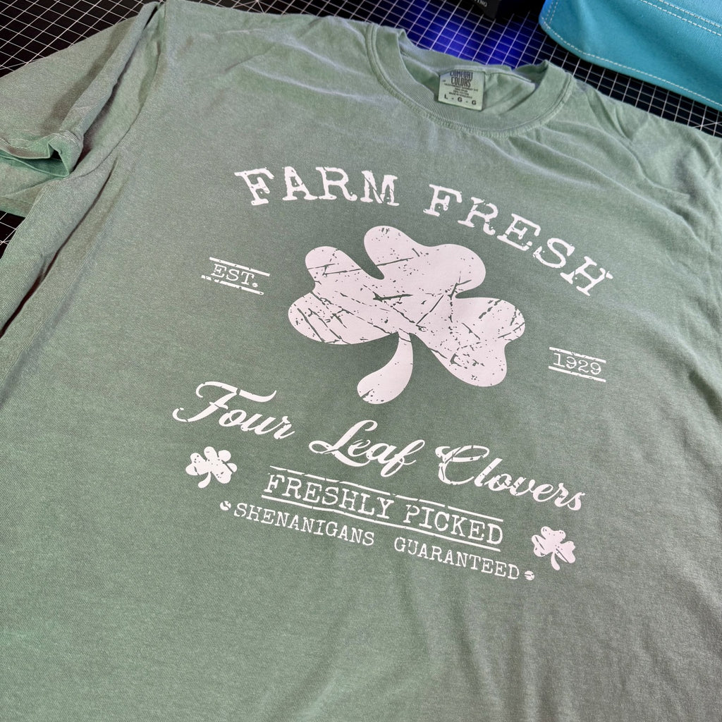 Green Farm Fresh Four Leaf Clovers western St Patricks Day graphic tee with distressed shamrock design