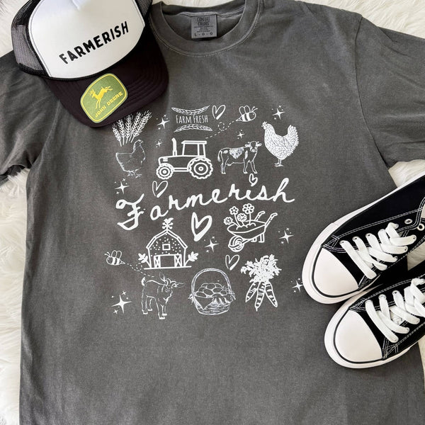 Farmerish graphic tee with white hand-drawn farm doodles on a Comfort Colors shirt styled with hats and sneakers.