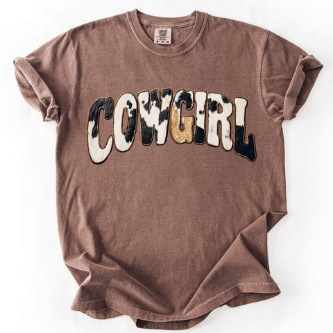 Brown cowgirl graphic tee featuring faux cowhide animal print lettering on a Comfort Colors shirt