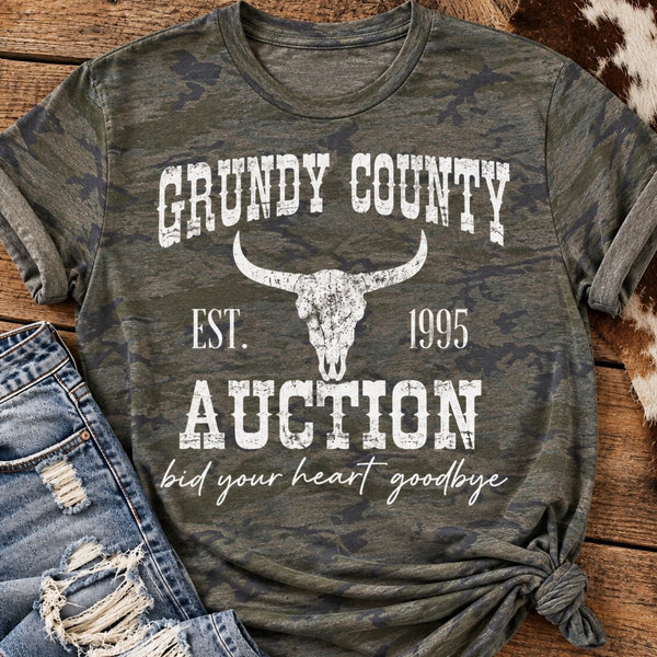 Vintage country camouflage graphic shirt featuring distressed Grundy County Auction lettering and longhorn skull print