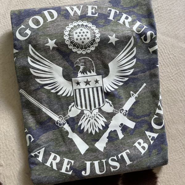God We Trust graphic tee on camouflage shirt featuring patriotic eagle crest and American-themed design