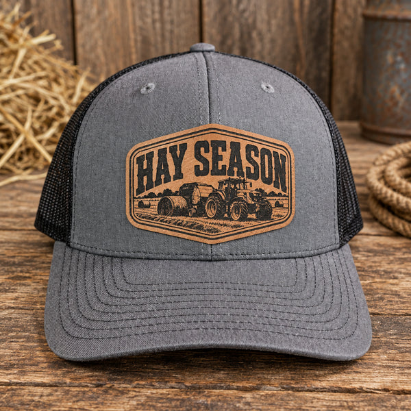 Hay Season tractor leather patch hat on gray and black Richardson 112 trucker cap