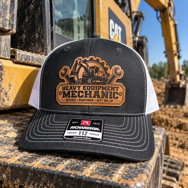 Heavy Equipment Mechanic leather patch Richardson 112 trucker hat displayed on an excavator