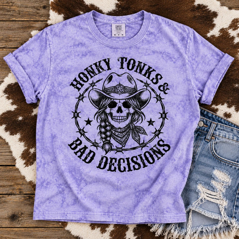 Honky Tonks and Bad Decisions cowgirl skeleton graphic on purple Comfort Colors Color Blast tee with distressed denim shorts