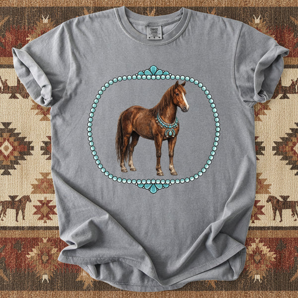 Gray comfort colors brand t-shirt with a horse graphic on a western themed background