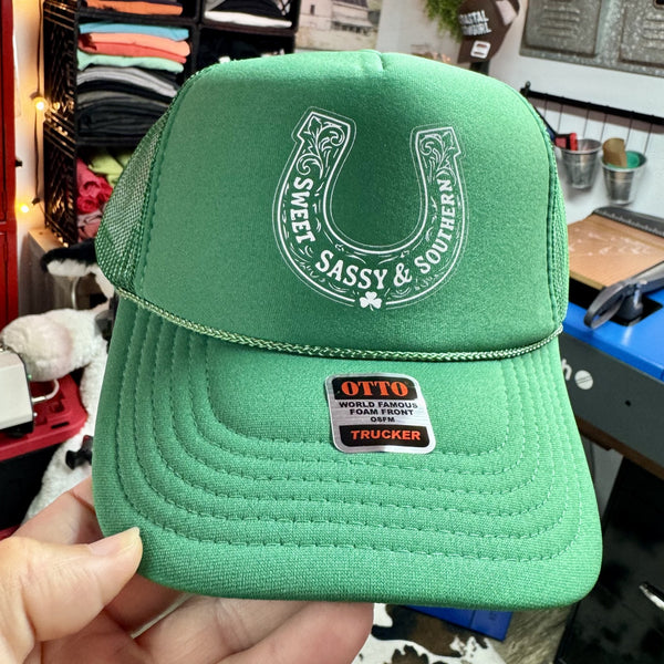 Sweet Sassy and Southern horseshoe trucker hat with shamrock design on green foam mesh cap