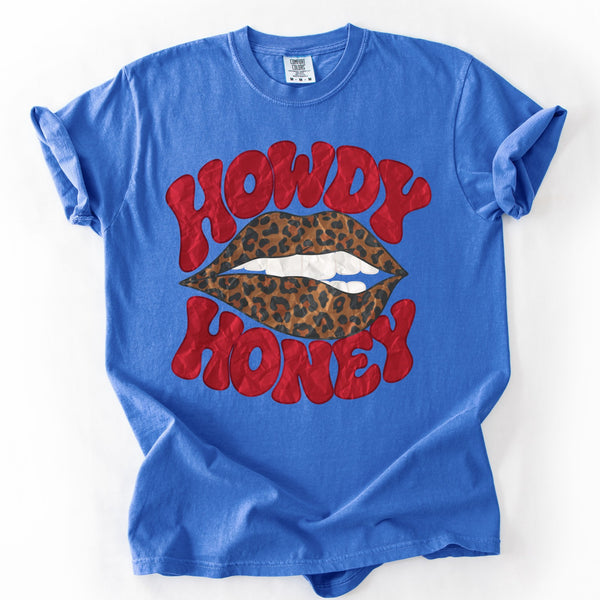 Howdy Honey leopard lips graphic on a Comfort Colors Flo Blue unisex graphic tee.