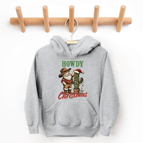 Gray hoodie with Cowboy Santa Claus and cactus design on a wooden rack