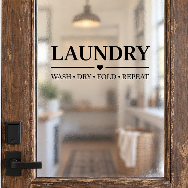 Laundry room door decal with Laundry and Wash Dry Fold Repeat lettering on rustic wood framed frosted glass door