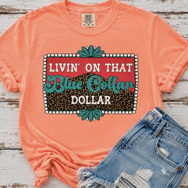 Blue Collar Dollar graphic Comfort Colors tee in Neon Cantaloupe with distressed denim shorts