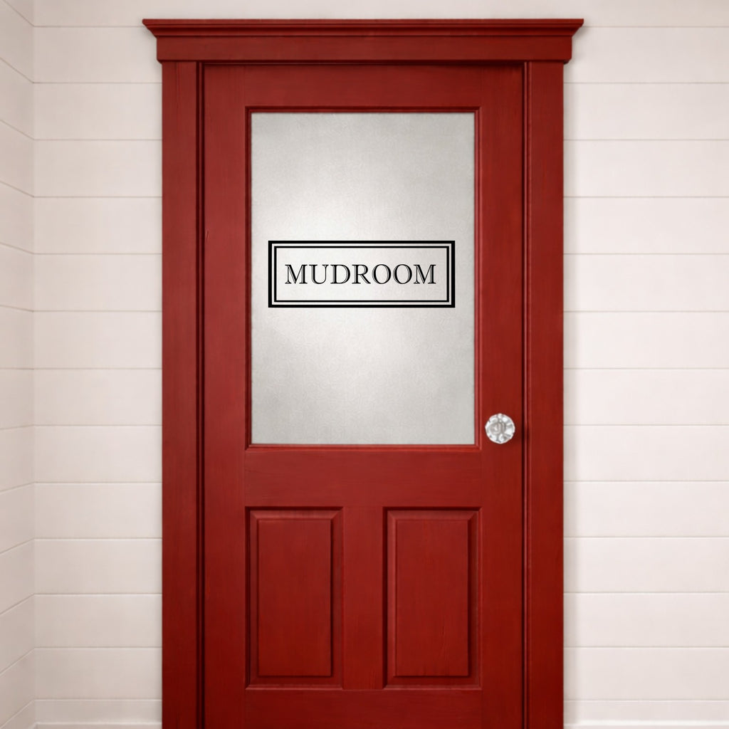 Red door with a 'MUDROOM' vinyl door decal on a white wall