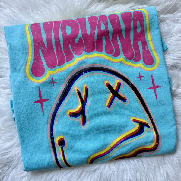 Nirvana inspired graphic tee on mint blue shirt featuring distressed smiley face design