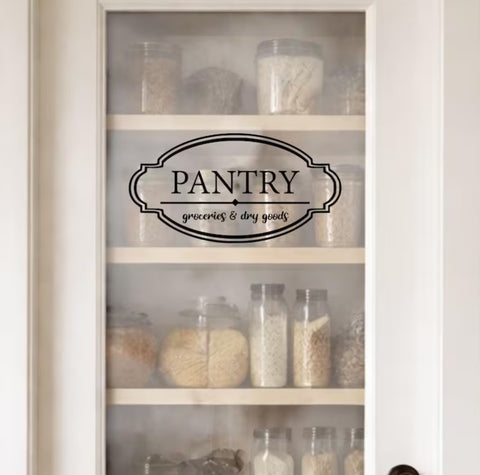 Pantry cabinet with jars and a 'Pantry Door Decal' sign on a white background.