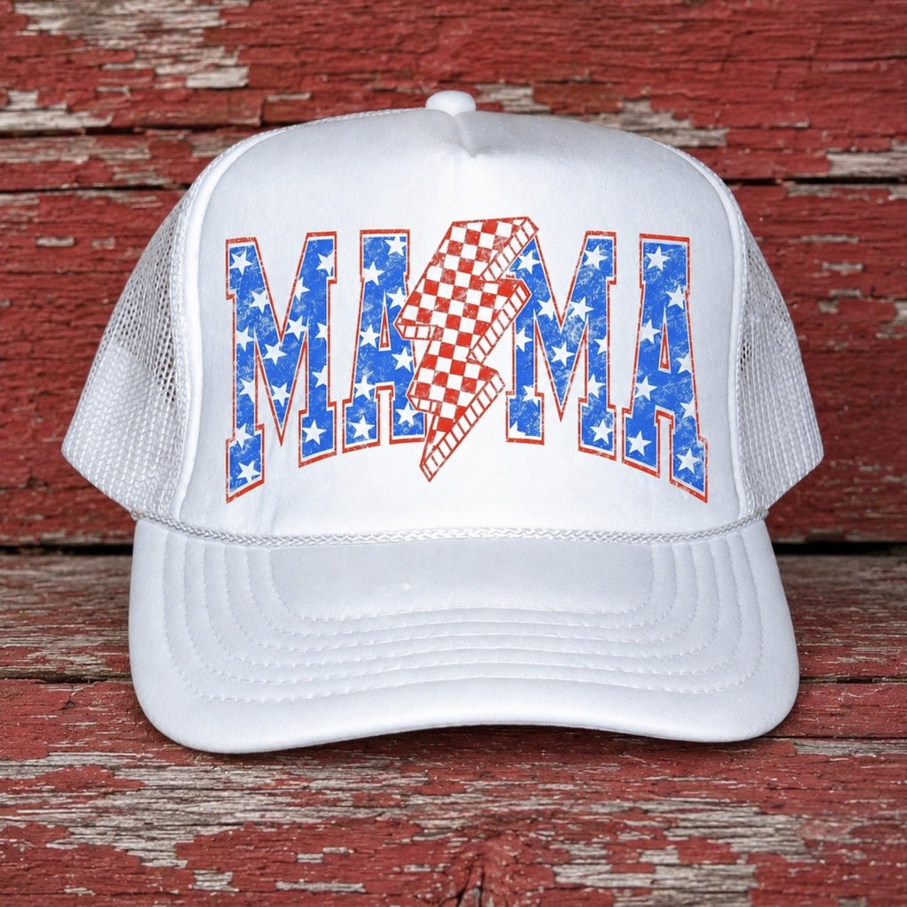 White patriotic mama trucker hat featuring red white and blue stars with a checkered lightning bolt design on a rustic red barn wood background