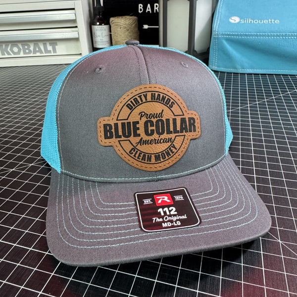 Gray and neon blue Richardson 112 trucker hat with brown leather Proud Blue Collar American Dirty Hands Clean Money patch.