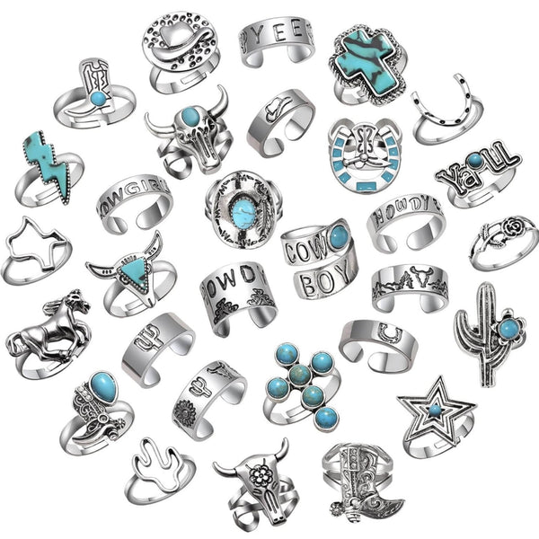 Collection of silver and turquoise rings on a white background