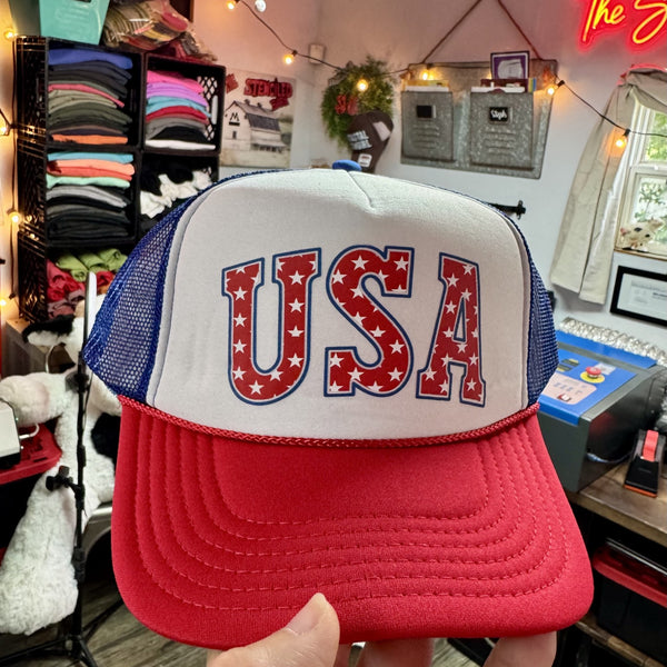 USA patriotic foam trucker hat with red white and blue stars design on red white and blue mesh cap