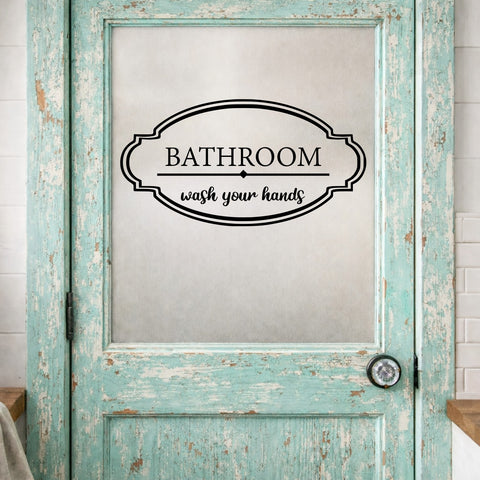 Vintage-style bathroom door with 'Bathroom wash your hands' sign