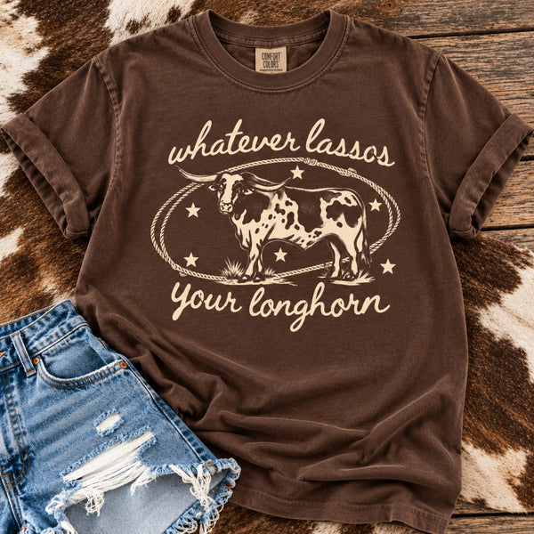Espresso Comfort Colors graphic tee featuring an antique white vintage longhorn design and Whatever Lassos Your Longhorn saying, styled with denim shorts.