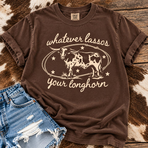 Espresso Comfort Colors graphic tee featuring an antique white vintage longhorn design and Whatever Lassos Your Longhorn saying, styled with denim shorts.