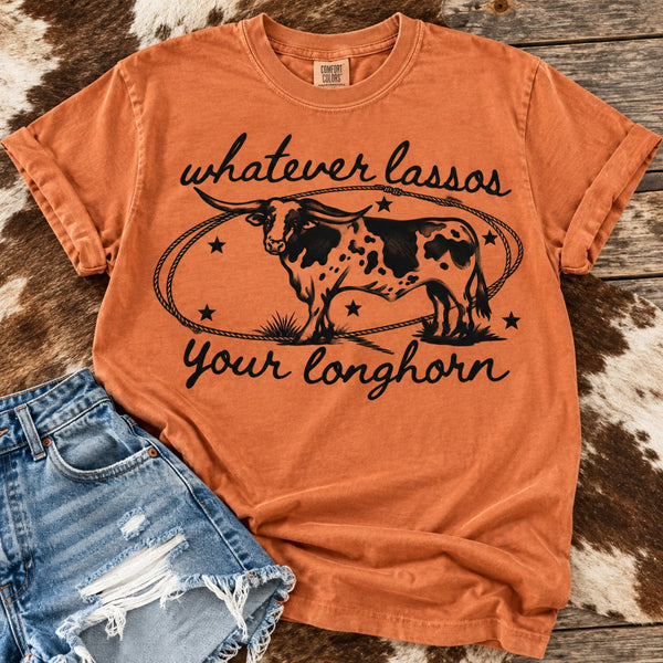 Yam Comfort Colors graphic tee featuring a black vintage longhorn cattle design and Whatever Lassos Your Longhorn saying, styled with distressed denim shorts.