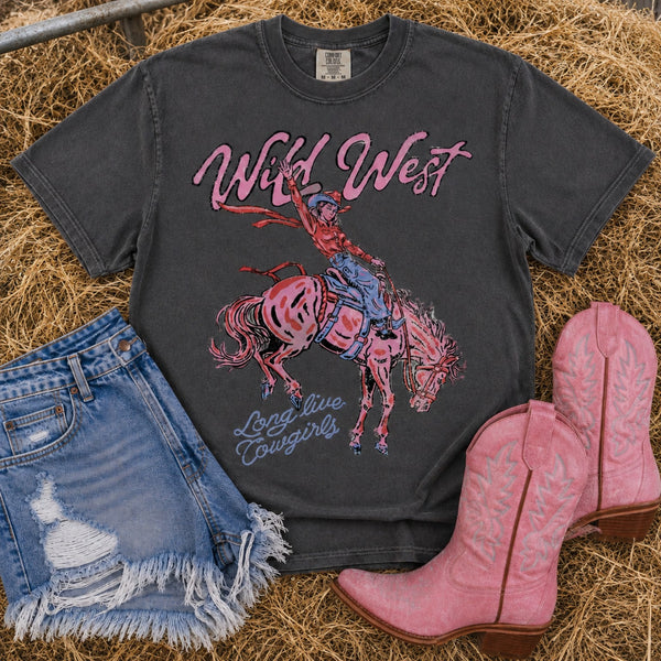 Wild West cowgirl Comfort Colors Pepper graphic tee with vintage bronc rider design styled with distressed denim shorts and pink cowboy boots